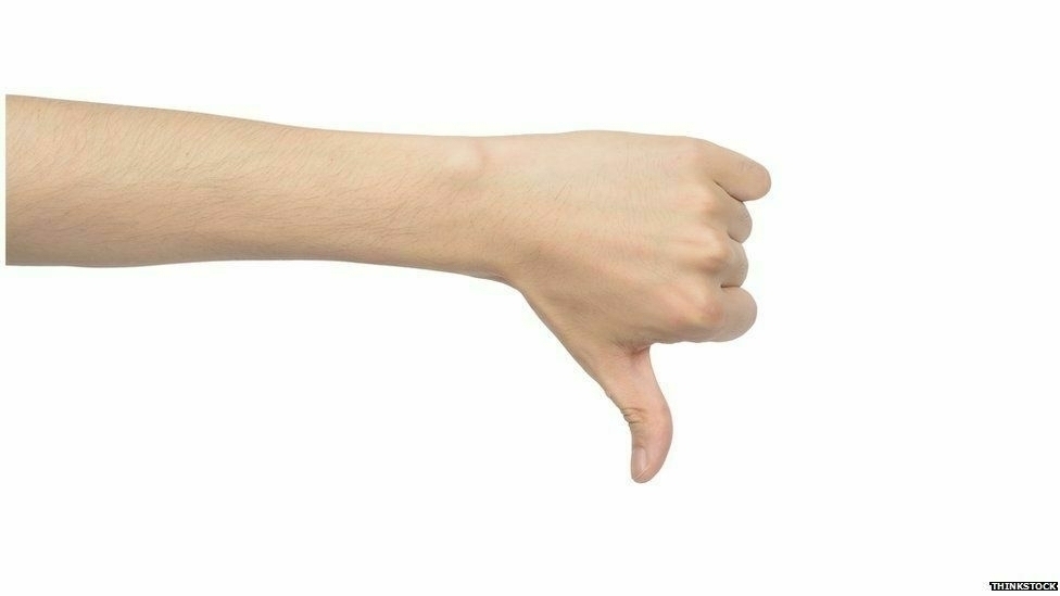 a hand giving the thumbs down sign