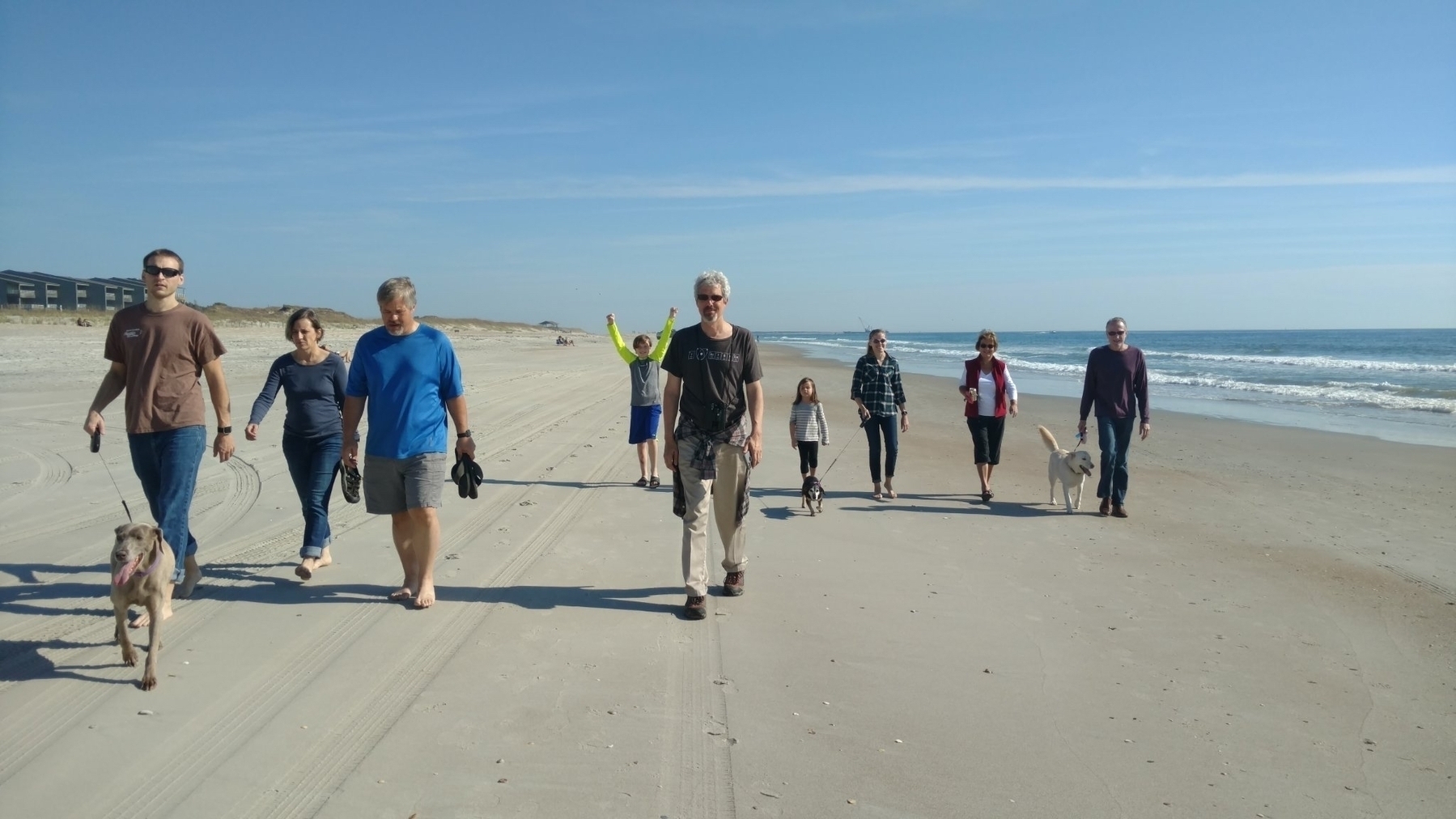 A Family Walking on the Beach