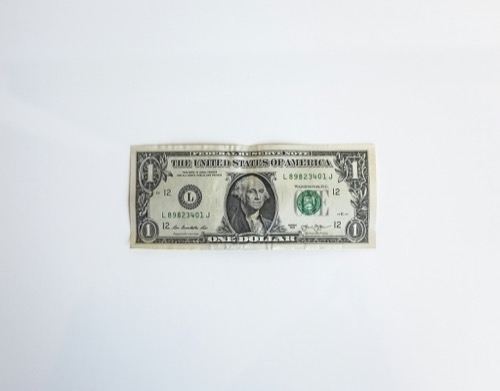 a US dollar bill lying on a table