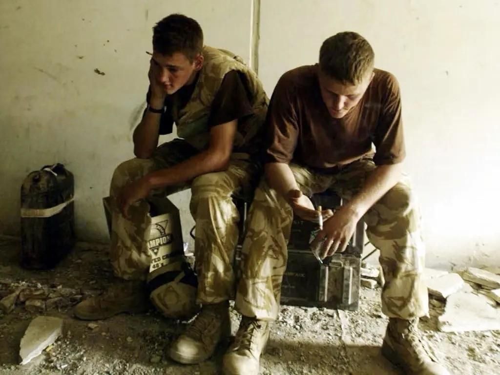 Two soldiers, sitting