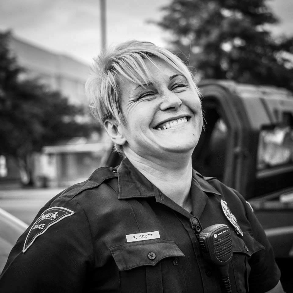 A smiling police office