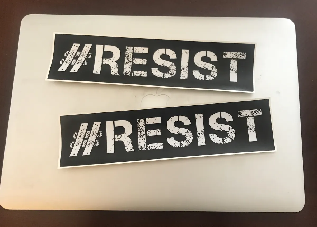 resist_stickers_on_laptop