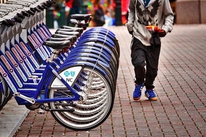 Row of blue bikes for hire